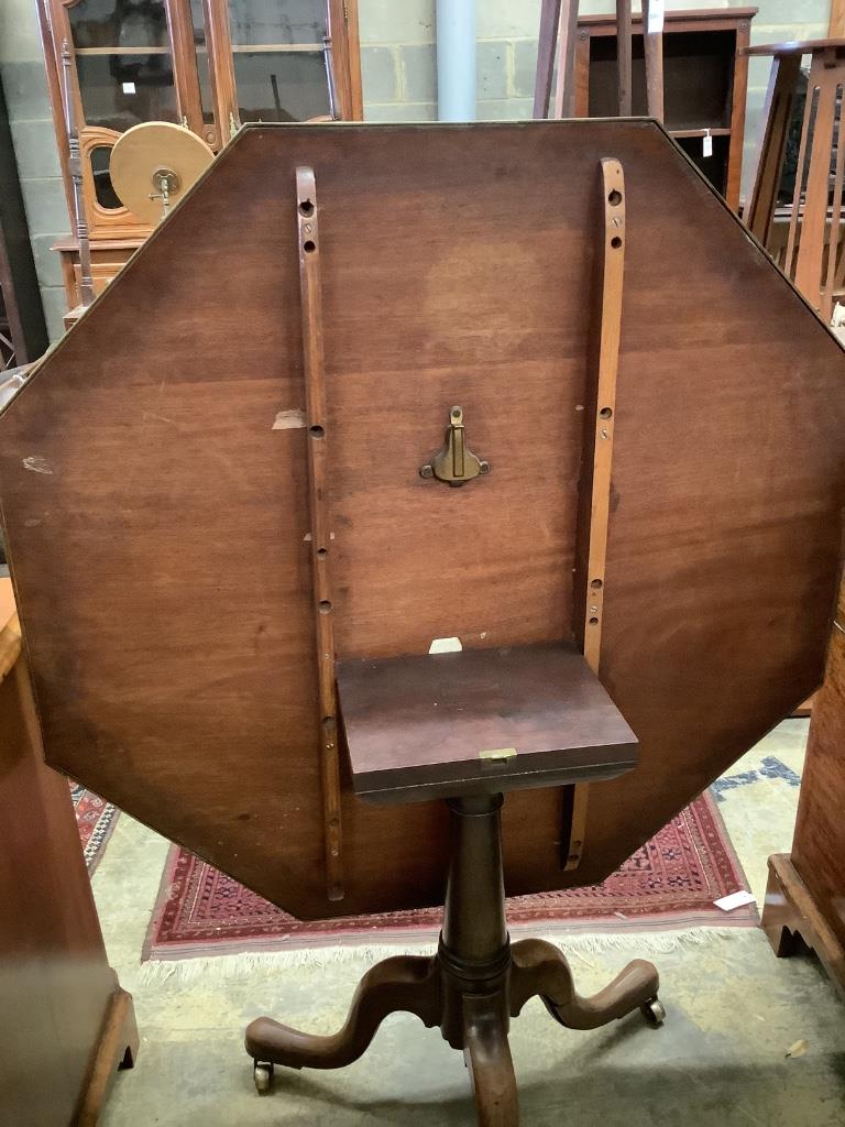 Two similar George III parquetry inlaid mahogany octagonal tilt top tables, width 96cm, height 73cm